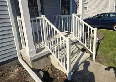 Michigan home entryway featuring white aluminum railings built by Wayne Craft